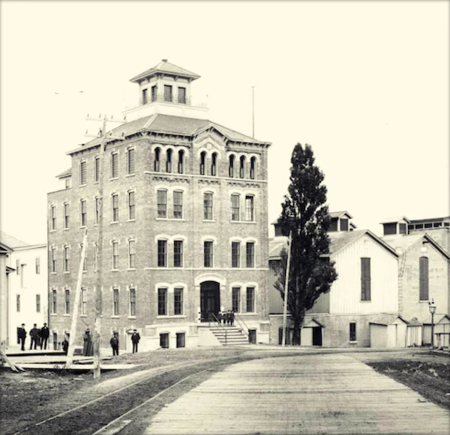A black-and-white photo of the original Muskegon Brewing Company.