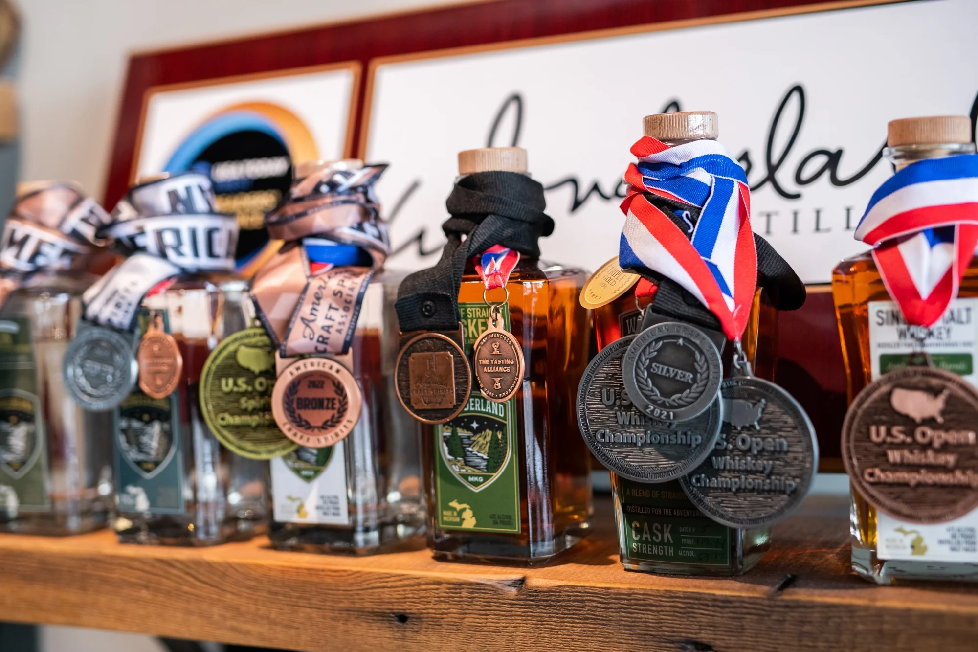 Award-winning Wonderland Distilling bottles wearing their medals