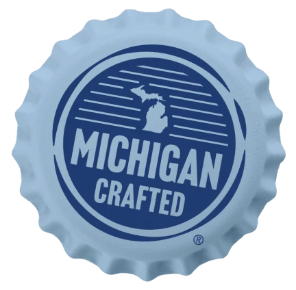 Play the Southwest Michigan video — a bottle cap with the Michigan Crafted logo